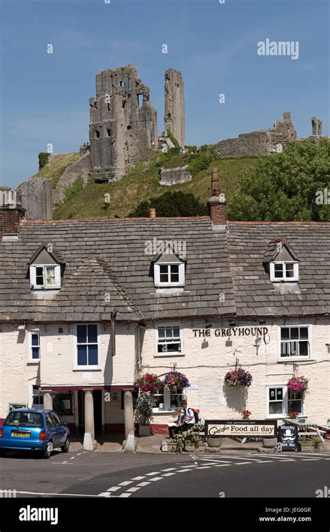 Corfe Castle Overlooks The Old Greyhound Pub On The Market Square Corfe