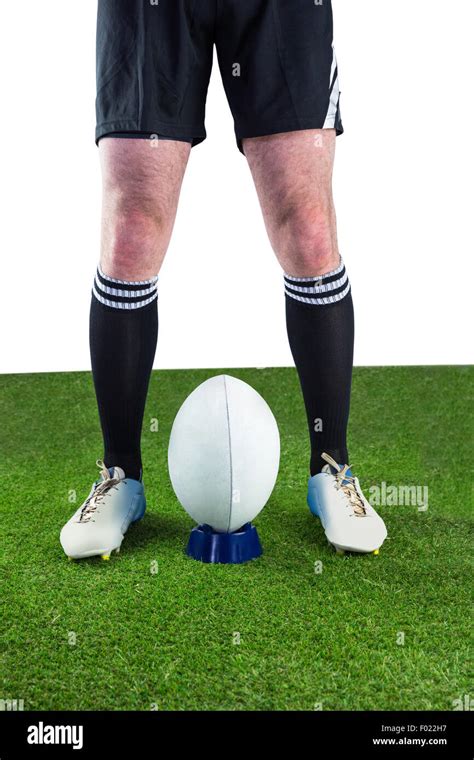 Rugby player ready to make a drop kick Stock Photo - Alamy