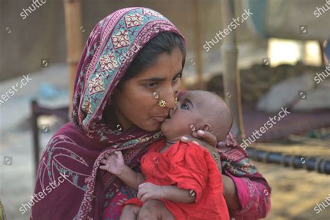 pakistani mother playing expressing affection  editorial stock photo