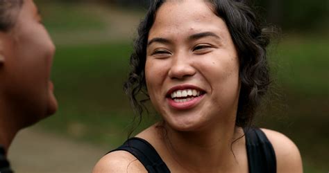 Latina Girl Laughing Outdoors With Friend Stock Footage Sbv Storyblocks