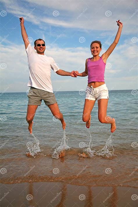 Couple Jump Stock Image Image Of Gravity Coastline People 2524473