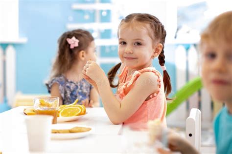 Tree Funny Kids Eating Fruits in Day Care Centre Stock Photo - Image of ...