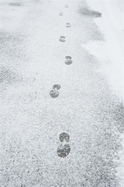 Footprints in the snow stock image. Image of approach - 111194329