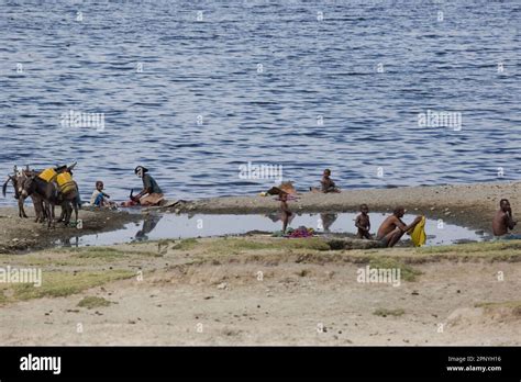 Group Of Ethiopians Doing Laundry Wash Clothes In A Lake Stock Photo