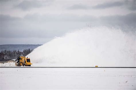 A 354th Civil Engineer Squadron Snow Broom Clears A NARA DVIDS