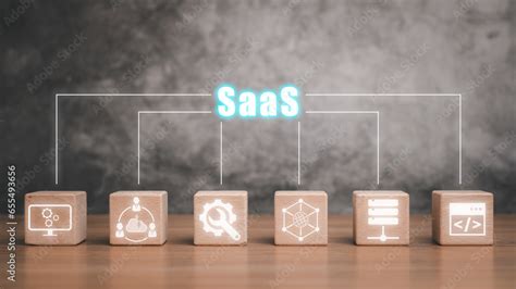 Saas Software As A Service Concept Wooden Block On Desk With Software