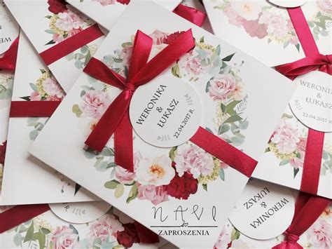 Many Wedding Cards With Red Ribbons And Flowers On Them