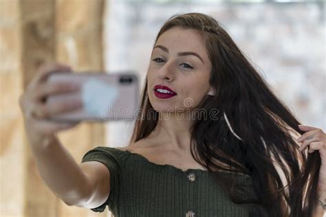 A Lovely Brunette Model Enjoys An Spring Day Outdoors Stock Photo Image Of Fashionable Cute