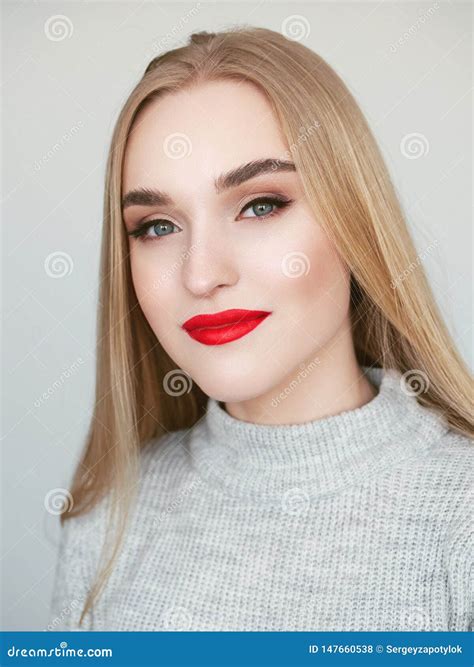 Closeup Natural Light Beauty Portrait Of Blonde Woman Model With Vibrant Saturated Red Lips