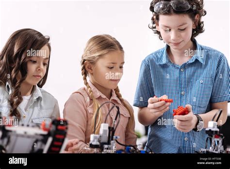 Attentive School Children Having Science Lesson At School Stock Photo