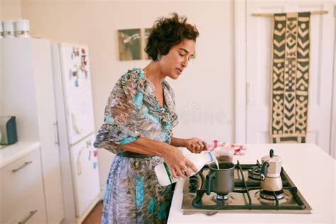 Mature Woman Busy Making Her Morning Cup Of Coffee At Home Stock Photo Image Of Cappuccino