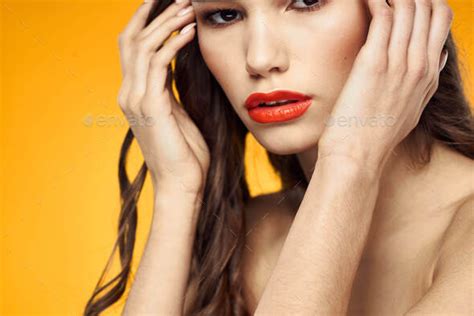 Beautiful Brunette Red Lips Bare Shoulders Skin Care Yellow Background Stock Photo By Shotprime