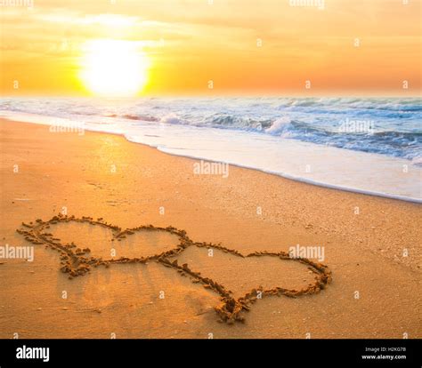 hand drawn hearts  beach sand  sunset stock photo alamy