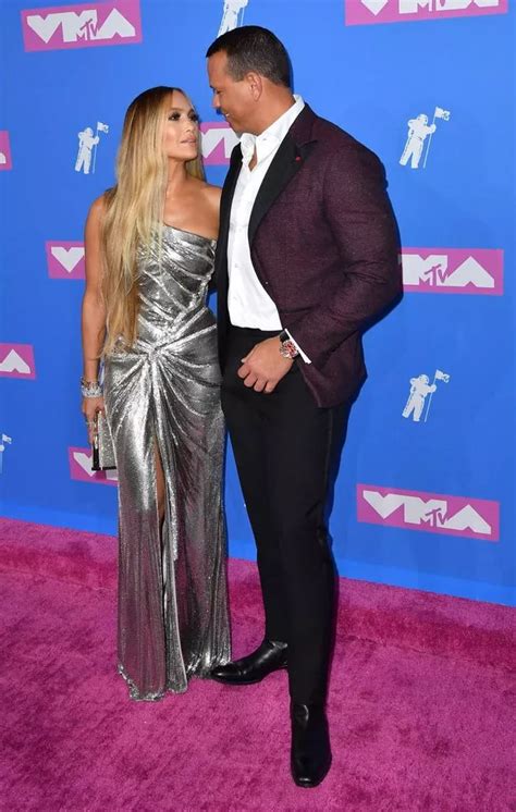 Jennifer Lopez is nearly naked as she poses in nothing but a shimmering cape for risqué