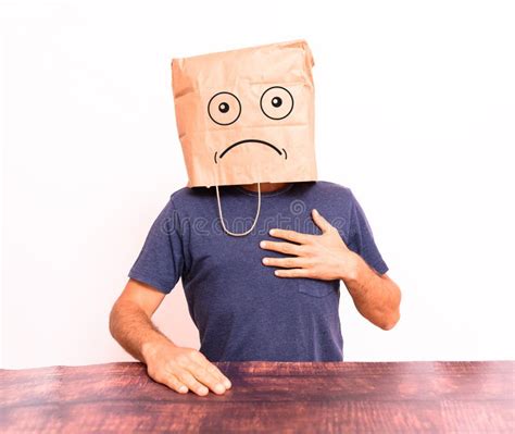 Mature Man Crestfallen Hiding His Identity Behind A Paper Bag Over His