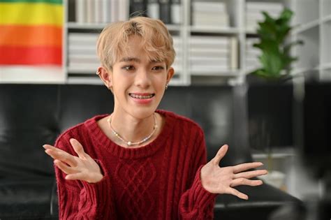 Premium Photo A Talented Asian Gay Blogger Speaks To The Camera And Films His Video While