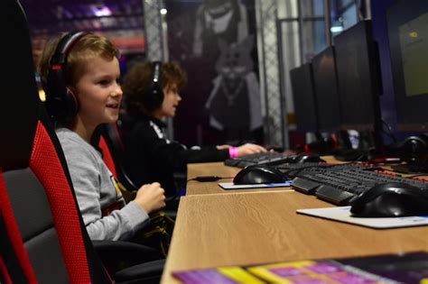 Premium Photo Kids Sitting On Table And Play Games