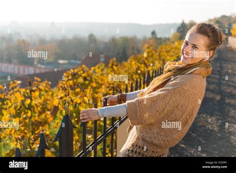 Portrait Of Happy Elegant Brunette Woman In Knitted Cardigan Relaxing