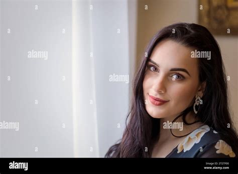 Beautiful Long Haired Brunette Girl With A Magical Smile Is Posing