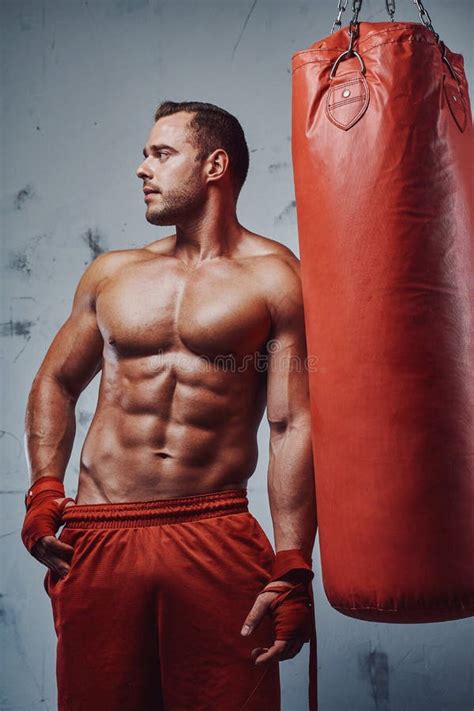 Muscular Boxer With Naked Torso Training With Punching Bag Stock Image Image Of Indoor Muscle