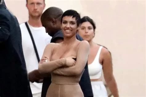 Kanye West S Wife Bianca Censori Covers Chest As She Slips Into Skintight Nude Outfit Kanye