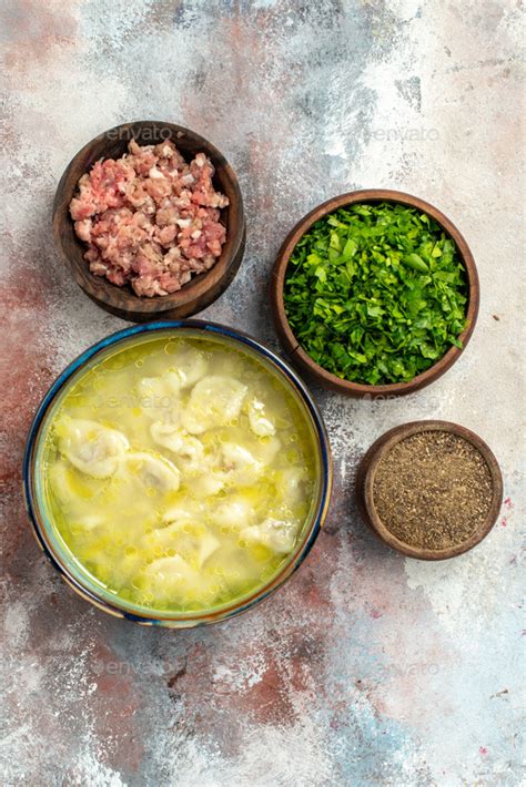 Top View Dushbara Dumplings Soup Bowls With Meat Greens Pepper On Nude Background Traditional
