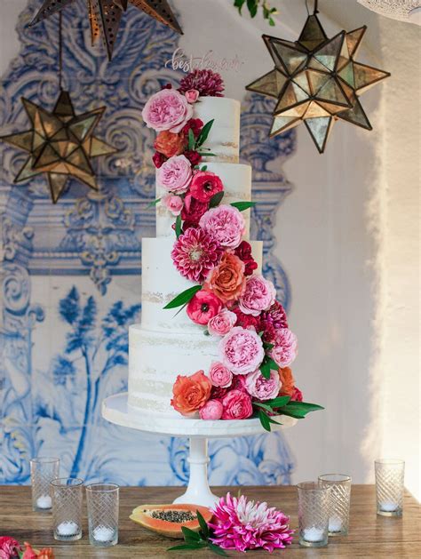 White Tiered Naked Cake With Bright Coral And Orange Cake Flowers