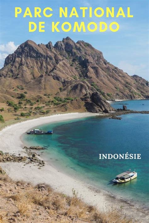 An Image Of A Boat On The Beach With Mountains In The Background And