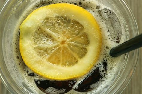 Premium Photo | Fresh lemon slice on the iced cola soft drink