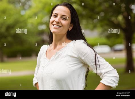 Portrait Of A Cheerful Brunette Posing Stock Photo Alamy