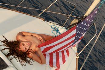 Sexy Babe Yonifer Salsa Posing With An American Flag On The Boat Photos