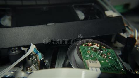 Vhs Tape Inserted And Playing In A Vcr Machinery Stock Video Video Of