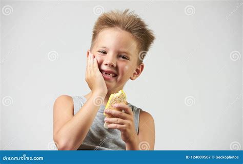 Funny Toothless Boy With Sensitive Teeth Holding Ice Cream Stock Image