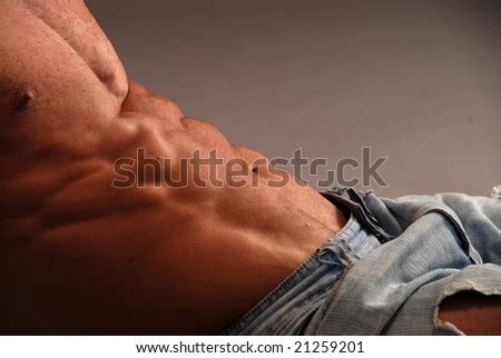 Male Bodybuilder Sexy Abs In Jeans Laying Stock Photo 21259201