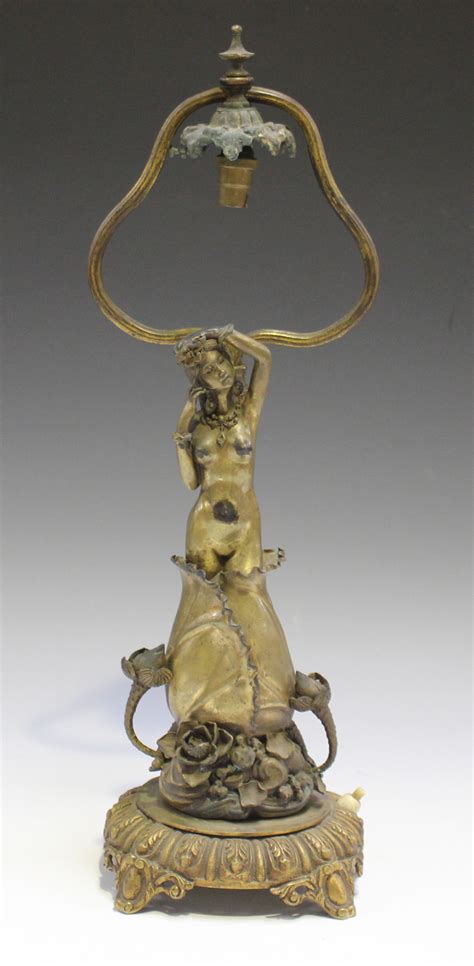 An Austrian Art Nouveau Cast Gilt Bronze Table Lamp Base Finely Modelled As A Nude Maiden Emerging