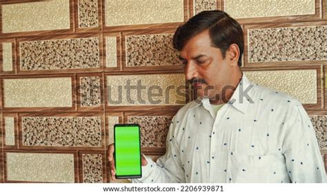Indian Mature Man Holding Mobile Phone Stock Photo Shutterstock