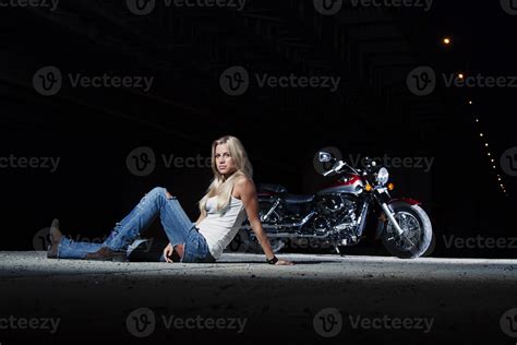 Sexy Blonde Sitting Near Her Motorcycle 2286569 Stock Photo At Vecteezy