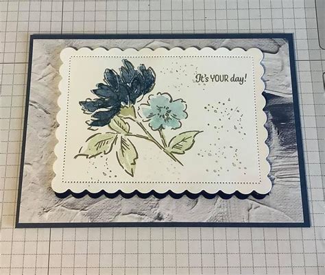 A Close Up Of A Card With Flowers On It