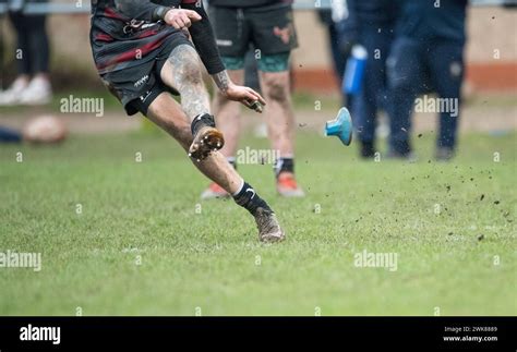 Male Amateur Rugby Union Football Players Playing A Game Of Rugby And Kicking The Rugby Ball For