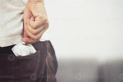 Condom Man Ready To Use In Jeans Pocket Give Condom Safe Sex Concept On The Bed Prevent