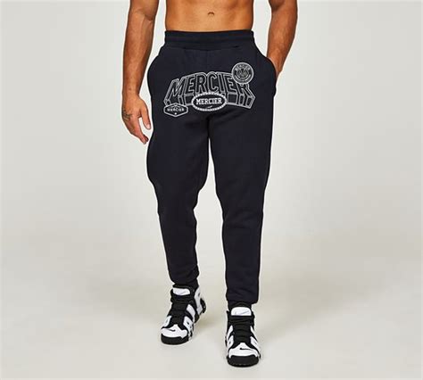 Mercier Court 20 Badge Jogger Navy Pebble Footasylum
