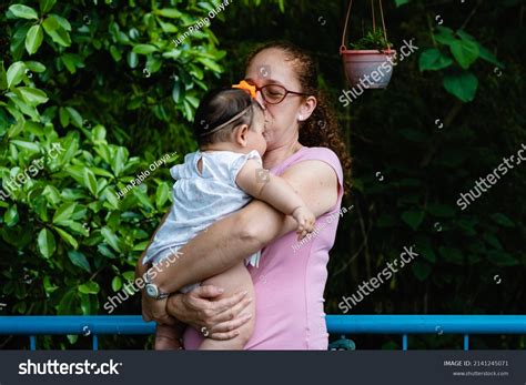 Latina Aunt Kissing Images Stock Photos And Vectors Shutterstock