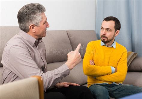 Adult Father And Son Solve Problems Stock Photo Image Of Mature Persuade