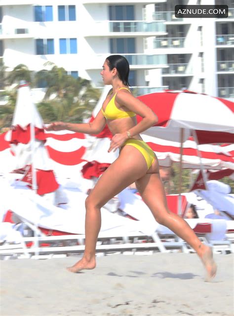 Dua Lipa Sexy In Yellow Bikini As She Takes Dip In The Ocean With Her SisterRina In Miami AZNude