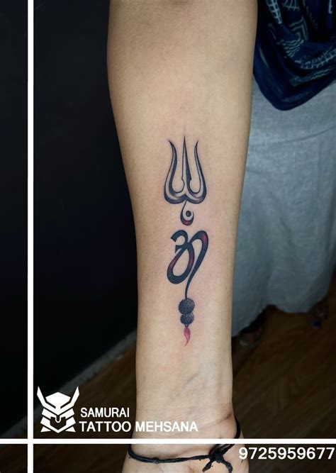 A Tattoo On The Leg Of A Woman With An Omen Symbol Tattooed On It