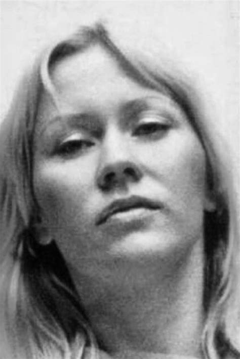 A Black And White Photo Of A Woman With Blonde Hair