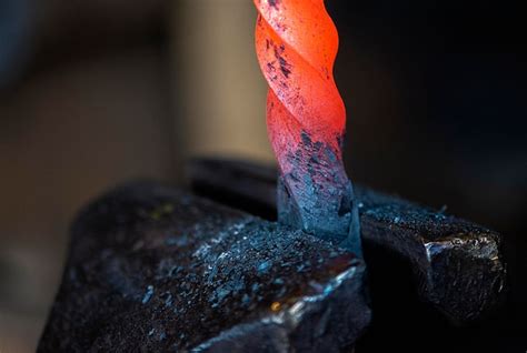 Premium Photo Closeup Of Hot Metal On Anvil In Blacksmith Workshop