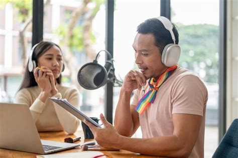 Premium Photo A Focused Asian Gay Man Radio Host Is Talking And