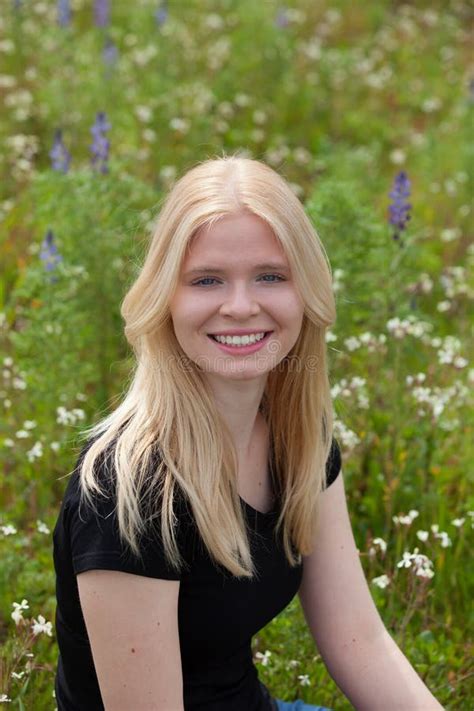 Happy Blonde Girl Surrounded By Flowers Stock Photo Image Of Healthy Happy