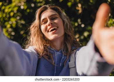 Happy Satisfied Curly Blonde Girl Gives Stock Photo 2203265203 Shutterstock
